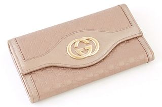 Gucci Metallic Light Pink Micro Guccissima Leather Sukey Continental Wallet, the calf leather with a golden brass Gucci logo on front, opening to two 