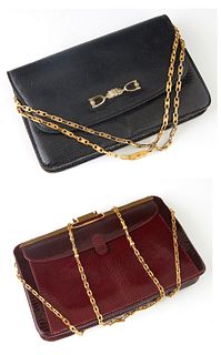 Two Vintage Handbags, one a vintage black snakeskin Celine with gold hardware, the snap closure opening to a black leather lined interior with a side 