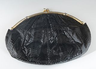 Judith Leiber Black Snakeskin Shoulder bag, with gold hardware, the snap closure opening to a black silk lined interior with an open pocket on one sid