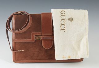 Vintage Gucci Brown Suede and Leather Clutch, with gold G accents, the leather slip closure opening to a dark brown and saddle brown leather interior,