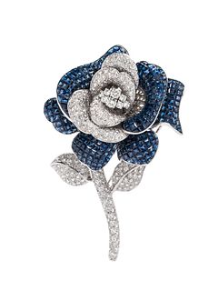   INVISIBLY-SET SAPPHIRE AND DIAMOND FLOWER BROOCH