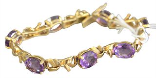 18 Karat Gold Bracelet, set with oval amethysts, length 6 3/4 inches, total weight  20.3 grams.