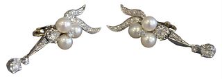 Pair of 14 Karat White Gold Earrings, set with diamonds and pearls, clip on, length 1 3/4 inches, total weight 10.3 grams. 
