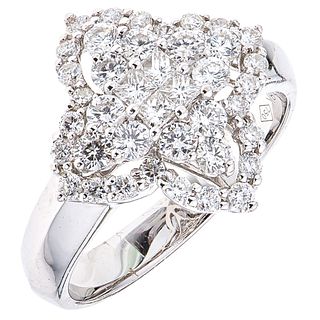 RING WITH DIAMONDS IN 18K WHITE GOLD 36 Brilliant cut diamonds ~0.90 ct and 4 Princess cut diamonds ~0.20 ct. Size: 7