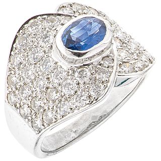 RING WITH SAPPHIRE AND DIAMONDS IN 18K WHITE GOLD 1 Oval cut sapphire ~0.70 ct and 46 Brilliant cut diamonds ~1.20 ct. Size: 6