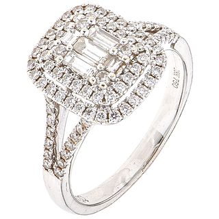RING WITH DIAMONDS IN 18K WHITE GOLD 5 Baguette cut diamonds ~0.30 ct and 84 Brilliant cut diamonds ~0.50 ct. Size: 7 ½