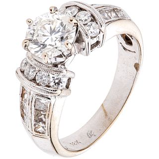 RING WITH DIAMONDS IN 18K WHITE GOLD 1 Brilliant cut diamond ~1.0 ct and 20 Diamonds (different cuts) ~0.66 ct. Size: 6 ¾