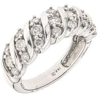 RING WITH DIAMONDS IN 14K WHITE GOLD 21 Brilliant cut diamonds ~0.77 ct. Weight: 5.4 g. Size: 7