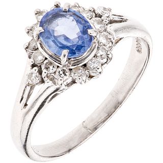 RING WITH SAPPHIRE AND DIAMONDS IN PLATINUM 1 oval cut sapphire ~0.70 ct  and 16 Brilliant cut diamonds ~0.32 ct. Size: 6