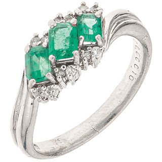 RING WITH EMERALDS AND DIAMONDS IN PLATINUM 3 Octagonal cut emeralds~0.56 ct and 12 Brilliant cut diamonds~0.12ct. Size: 6½