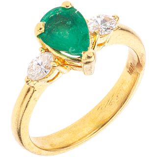 RING WITH EMERALD AND DIAMONDS IN 18K YELLOW GOLD 1 Pear cut emeralds ~0.65 ct and 2 Marquise cut diamonds ~0.30 ct