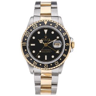 ROLEX OYSTER PERPETUAL DATE GMT-MASTER II WATCH IN STEEL AND 18K AND 14K YELLOW GOLD, CA. 1991  Movement: automatic