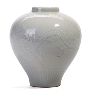A CHINESE WHITE CARVED FLORAL JAR