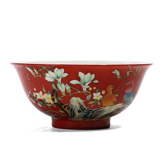 A CHINESE RED-GROUND FAMILLE ROSE FLOWERS BOWL