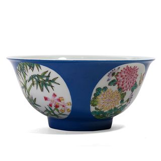 A CHINESE BLUE-GROUND FAMILLE ROSE FLOWERS BOWL
