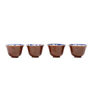 FOUR CHINESE BROWN-GLAZED BLUE AND WHITE CUPS