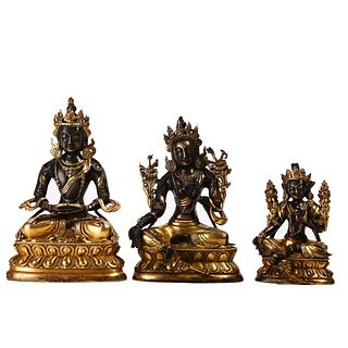A GROUP OF THREE GILT-BRONZE BUDDHA FIGURES