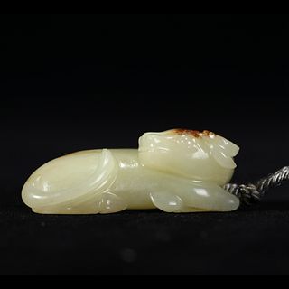 A WHITE JADE MYTHICAL BEAST CARVING 