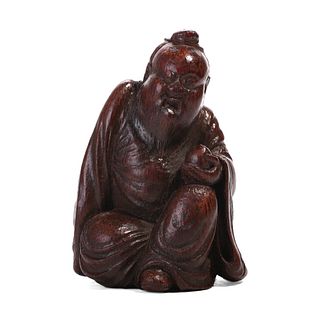 A CARVED BAMBOO FIGURE