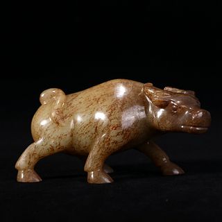 A JADE CARVING OF AN OX
