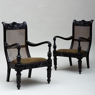 Pair of Anglo-Indian Carved Ebony and Caned Armchairs, Galle District, Ceylon