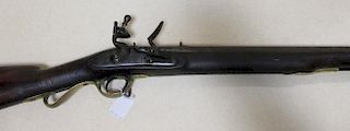 A flintlock military musket, the lock stamped with rampant lion on plinth & C over 1, brass mounts,