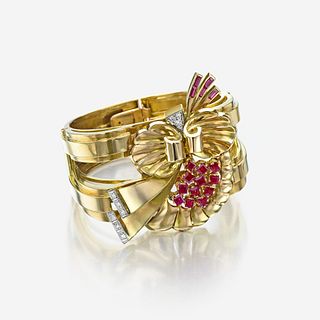 A Retro eighteen karat gold, ruby, and diamond bangle bracelet