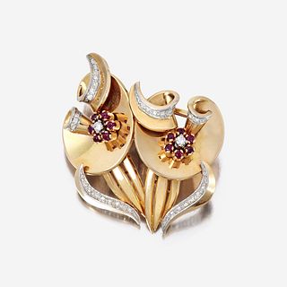 A Retro eighteen karat gold, diamond, and ruby clip/brooch