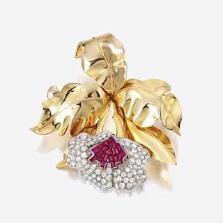 A Retro diamond, ruby, and eighteen karat gold clip brooch