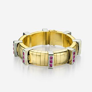 An eighteen karat bicolor gold and pink sapphire bracelet