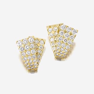 A pair of diamond and eighteen karat gold earrings
