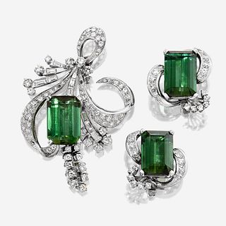 A pair of green tourmaline, diamond, and platinum ear clips and brooch