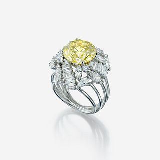 A colored diamond, diamond, and eighteen karat white gold ring