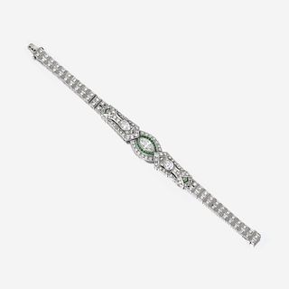 An Art Deco diamond, emerald, and platinum bracelet