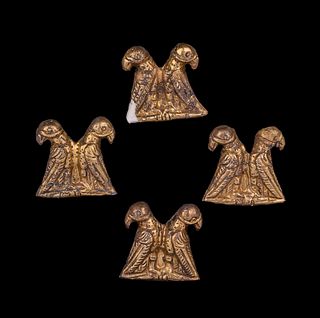 Four Thracian Gilt-Silver Double Eagle Plaques
Height of each 15/16 inches.