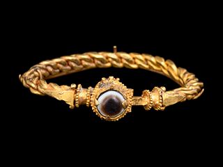 A Byzantine Solid Gold Bracelet with Agate Cabochon
Diameter 2 3/4 inches.