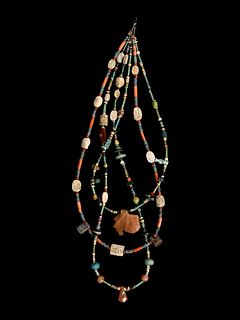 An Egyptian Stone and Faience Necklace
Length 14 inches. 