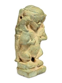 An Egyptian Faience Pataikos
Height 2 3/4 inches.