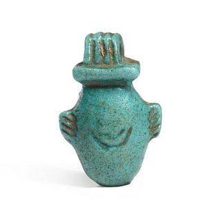 An Egyptian Faience Heart Amulet
Height 7/8 inches. 