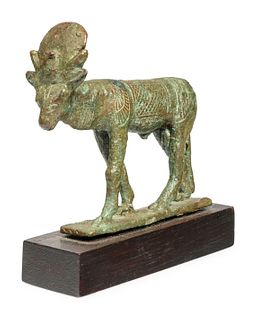 An Egyptian Bronze Apis Bull
Height 2 5/8 inches.