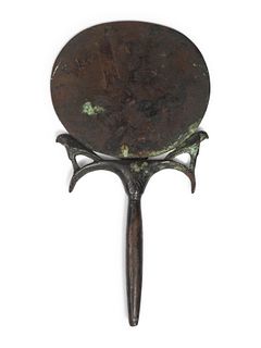 An Egyptian Bronze Mirror
Height 7 x width 4 inches. 