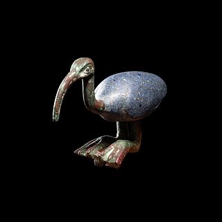 An Egyptian Bronze and Glass Ibis
Height 2 1/2 inches. 