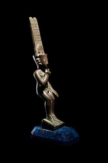 An Egyptian Bronze Harpocrates
Height 9 3/4 inches. 