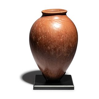 An Egyptian Red-Polished Pottery Jar
Height 8 3/4 inches.