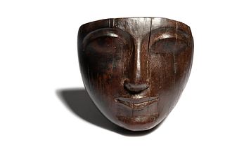 An Egyptian Wood Mummy  Mask
Height 4 3/4 x width 5 inches. 