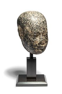 An Egyptian Stone Head of a Priest  
Height 3 3/4 inches.