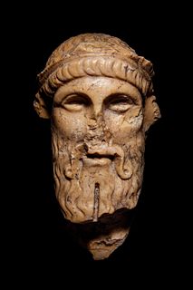 A Roman Giallo Antico Marble Herm Head of Dionysos
Height 6 inches. 