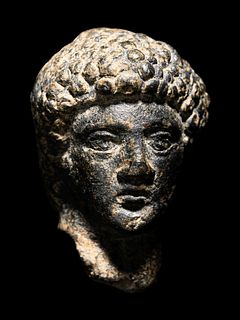 A Roman Bronze Head of Apollo
Height 1 3/4 inches. 