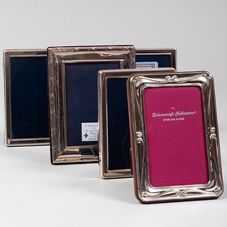 Group of Four English Silver-Mounted Picture Frames and an American Frame