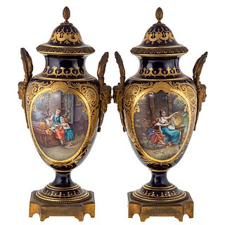 A Pair of Bleu De Rois Mounted Urns